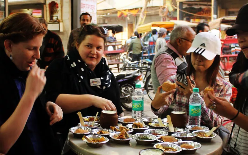 Tourist Eating India Food